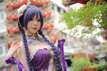 Portrait Of Asian Young Woman Dancing With Purple Chinese Dress Cosplay With Temple