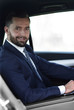 © ASDF - Close-up of a businessman with a laptop sitting in the car