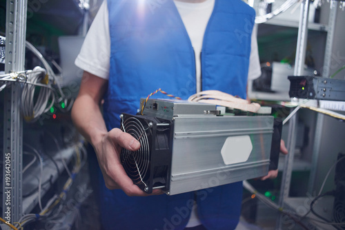 Mining A Man Works On A Cryptocurrency Farm Holds Bitcoin Mining - 
