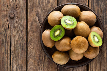 Wall Mural - Kiwi fruit on wooden rustic table, ingredient for detox smoothie