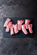 © Sea Wave - Raw uncooked pork ribs, fresh meat on dark metal background. Top view. Flat lay.
