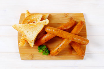 Wall Mural - thin sausages with toast