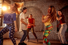 Group Of Modern Street Artist Break Dancers Dancing In The Studio. Sport, Dancing And Urban Concept