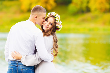 beautiful girl with long hair and a wreath of flowers on her hea