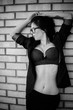 © T.Den_Team - Image of a sexy business woman in a bra with glasses. The concept of eroticism in everyday life, female attractiveness and attractiveness. Vintage elements in look