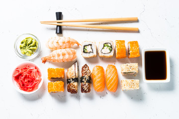 Sushi and sushi roll set on white background.