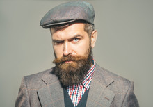 Elegant Fashion Man With Beard And Mustache With Retro Style. Confident Man Dressed In Stylish Retro Clothes. Pensive Man In Retro Clothes And Hat. Vintage Fashion - Man In Suit, Shirt, Waistcoat, Cap