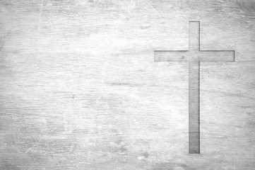 white old christian religion symbol cross shape as sign of belief on a grungy wood textured with cop