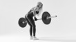 © USM Photography - Black and white photo of confident young woman doing weight lifting workout at gym turning back Attractive young woman bodybuilder lifting barbells looking focused at barbell Healthy lifestyle