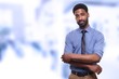 © Djomas - Young businessman in front of a blurred background