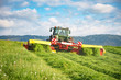 canvas print picture - Einsatz moderner Landtechnik bei der Grasmahd für Silage