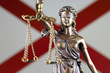 Symbol of law and justice with Alabama State Flag. Close up.