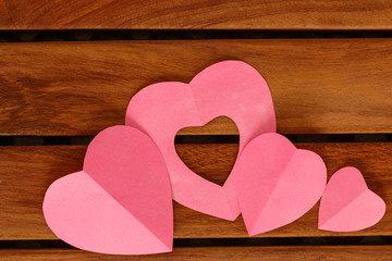 Valentine card with pink heart  on floor wood, concept love with copy space