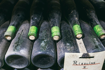 Dusty bottles of wine on the shelf