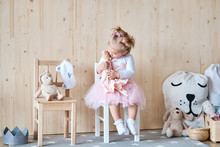 Amazing Little Girl Playing With A Doll In Her Room