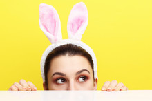 Happy Young Woman Wearing Bunny Ears