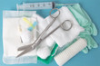 opened sterile dressing pack lying at the table ready to treat the wound