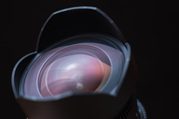 Camera lens on black background. Place for text or design