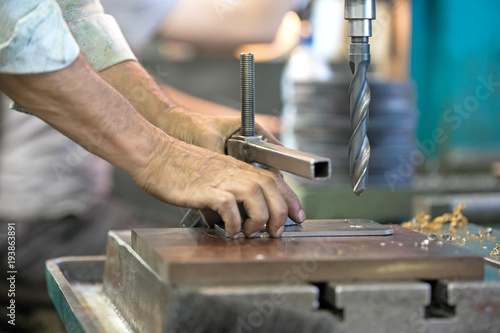 metalworking industry: close up boring on pillar drill machine with high speed s Poster