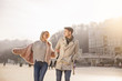 © Yakobchuk Olena - Happy together. Positive young couple on date is looking at each other with smile and adoration. They are enjoying spring day