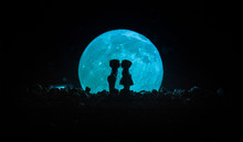 Silhouette Of Couple Kissing Under Full Moon. Guy Kiss Girl Hand On Full Moon Silhouette Background. Valentine`s Day Decor Concept. Silhouette Of Loving Couple Kissing Against The Moon