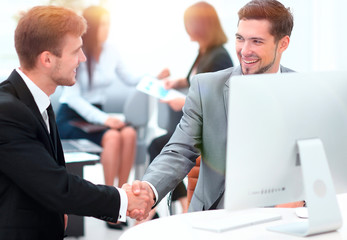 handshake Manager and the client in the office.