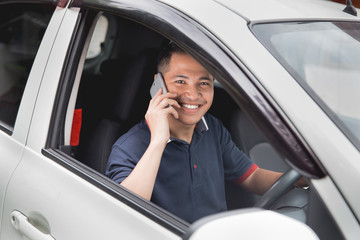 Wall Mural - man calling while driving a car