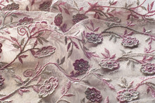 Texture, Background, Pattern. Pink Lace Decorated With Flowers On A White Background. Background Of Pink Lace Fabric Beautifully Decorated With Flowers