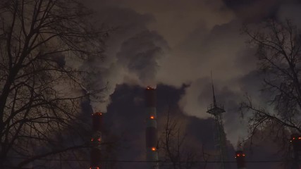 Wall Mural - power plant emitting smoke and vapor in cold weather, day and night