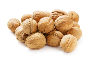 heap of walnuts in shell isolated on white background