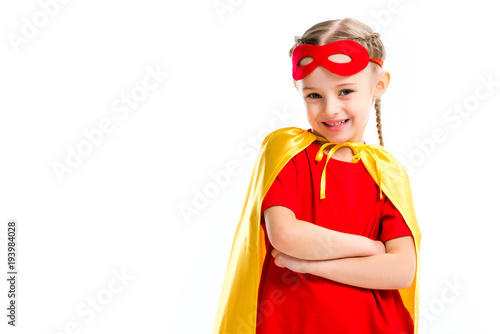 Excited little supergirl wearing yellow cape with red mask for eyes on forehead Poster