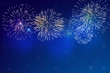Brightly Colorful Fireworks and blue smoke from firework on twilight background