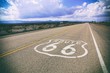 Famous Route 66 road marker on a California highway, USA. Vintage styling.