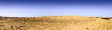 Wery Wide Panorama Of Desert Hills Under Blue Sky