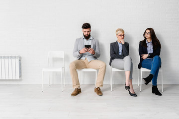 Young modern business people waiting for job interview 