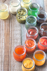 Poster - Assortment of sauces in the glass jars