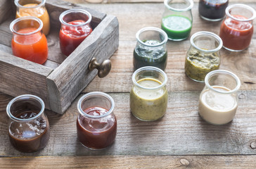 Canvas Print - Assortment of sauces in the glass jars