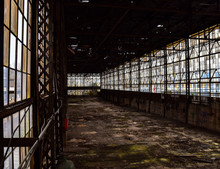 Broken Windows In Abandoned Warehouse Industrial Space