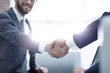 © ASDF - Close up of business handshake in the office