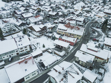 Aerial View Of Rooftops Of German Town In Winter. Everything Covered With Snow