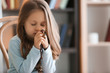 Religious Christian girl praying indoors