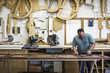 © Cavan Images - Confident carpenter working at workshop