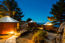 Yurts/tents Under Starlit Sky In The Woods, Big Sur, California