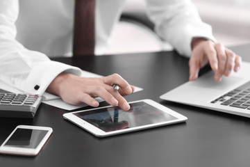 Poster - Young man working at table in office. Consulting service concept