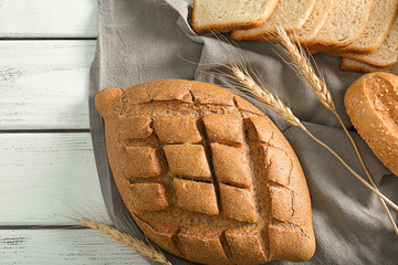 Poster - Loaf of freshly baked bread on table