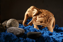 Indian Carved Elephant On The Blue Sand.