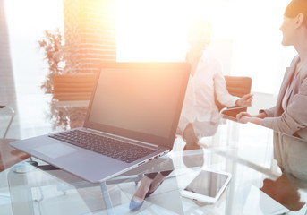 Poster - laptop and a smartphone on the desktop of a businessman