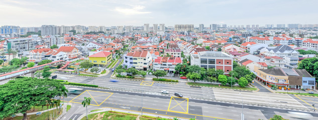 Wall Mural - Panorama residential house with high-rise buildings in background in Singapore. Busy traffic on highway.