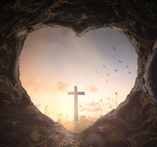 Good Friday Concept: Heart Shape Of Empty Tomb Stone With The Cross Over Meadow Sunrise Background