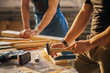 © alfa27 - carpenter with two students in woodworking workshop